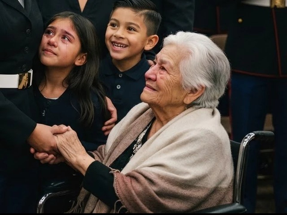 A retiring Marine holding her abuela hand with her children beside her
